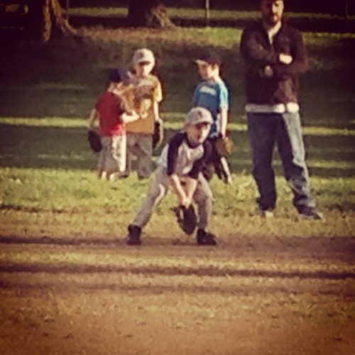 little league baseball catching a grounder